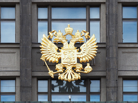 MOSCOW, RUSSIA - SEPTEMBER, 2017: Coat of arms of Russia on the facade building of the State Duma of the Russian Federation. Moscow at Okhotny Ryad Street,1