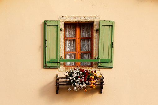 Building window flowers box shutters Italy Tuscany frame house home