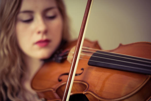 istock Female musician playing violin 847418850