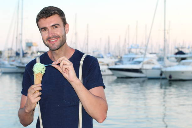 Man eating an icecream with a spoon