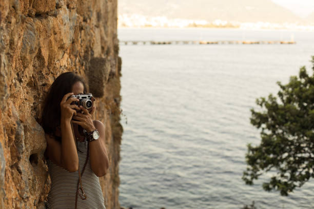 istock Traveller woman photographing 847419336