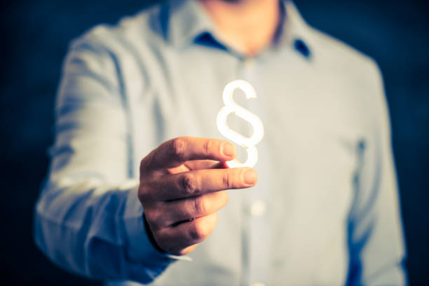 Lawyer holding a paragraph symbol