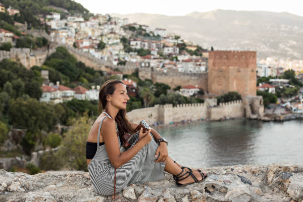 istock traveller woman holding vintage camera 847423300