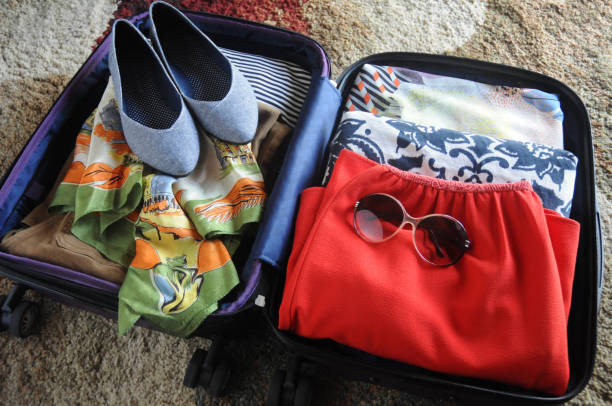 istock Packed Suitcase with Women's Clothing 847426070