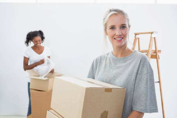 istock Pretty young housemates moving into new home 847438788