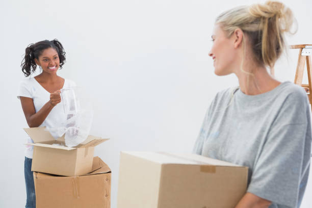 istock Cheerful young housemates moving into new home 847438810
