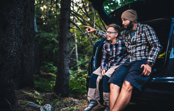 istock Father and son travelling by car 847439316