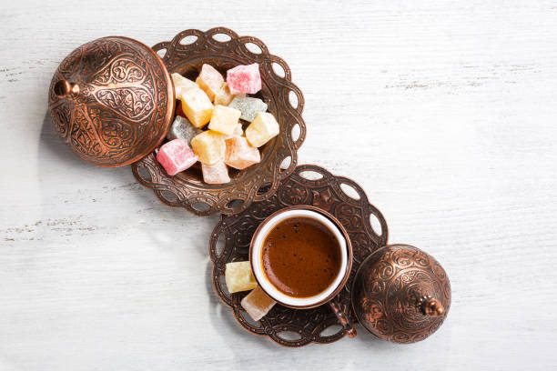 traditional turkish coffee and turkish delight on white shabby wooden background.  top view. - old fashioned horizontal black coffee cup imagens e fotografias de stock