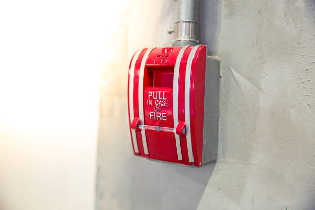 istock Selective focus on red gear alarm on the wall, pull in case for call fire emergency, fire alarm concept. 847442170