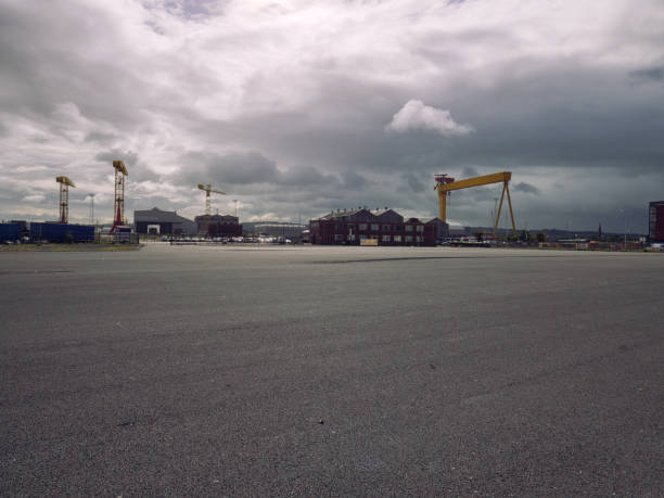 istock Empty road surface against blur Belfast city landmark background 847450016