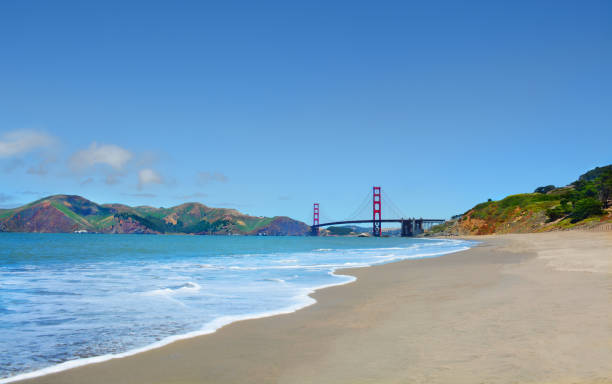 Beautiful coastal landscape, view Golden Gate Bridge. Beautiful coastal landscape. Golden Gate Bridge over Pacific Ocean, and San Francisco Bay visible from Baker Beach. mountains in the background..San Francisco, California, USA baker beach stock pictures, royalty-free photos & images
