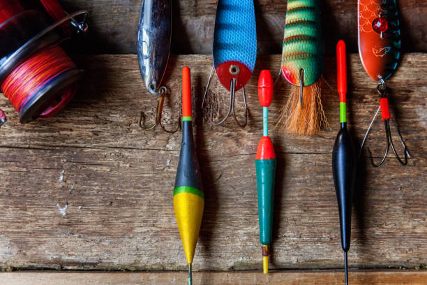 istock fishing tackle on a wooden surface 847465380