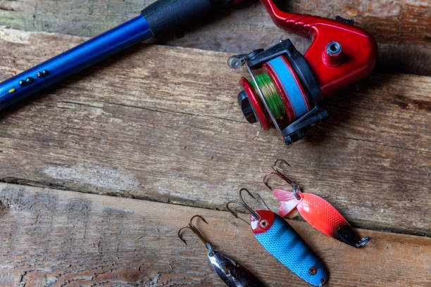 istock fishing tackle on a wooden surface 847465518