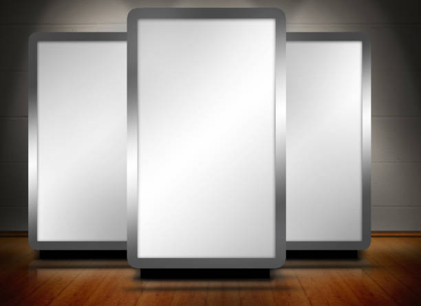 istock Three blank screens standing on wooden floor 847468540