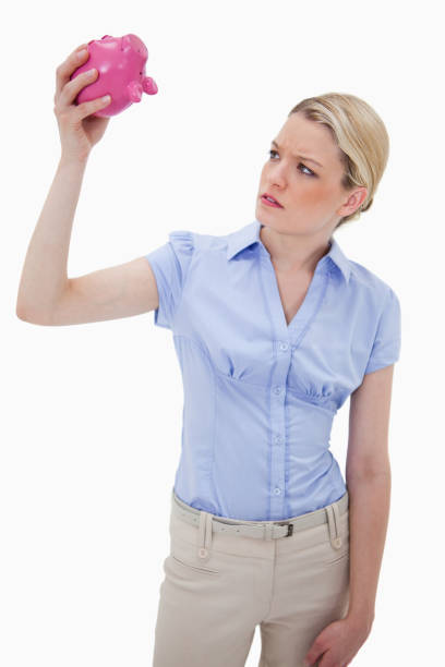 istock Sad woman with empty piggy bank 847469866