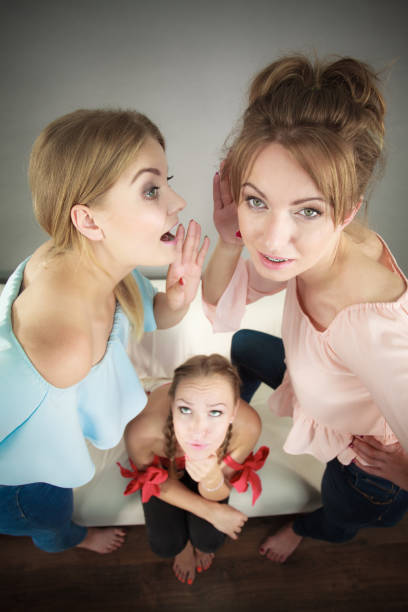 istock Woman being gossiped by two 847473568