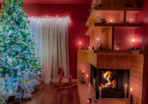 istock Christmas Tree in silver and gifts with roaring fireplace (P) 847473696