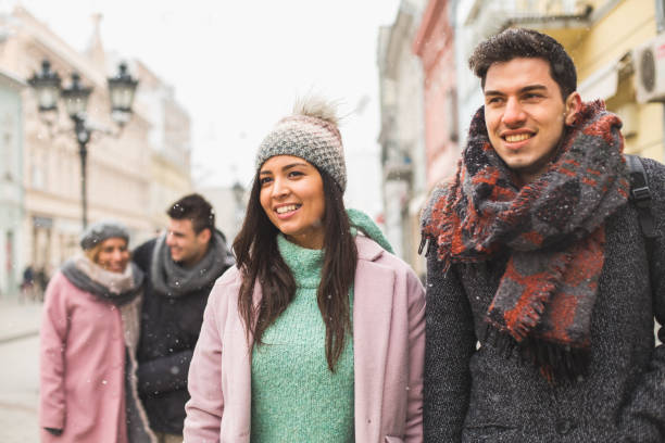 istock Four young people walking together in the city 847481230