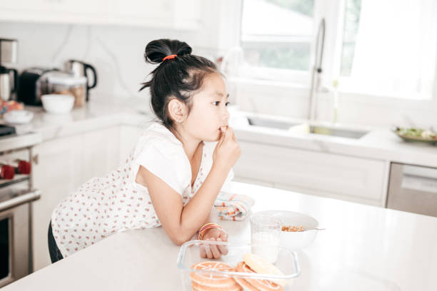 istock Girl in the kitchen 847483936