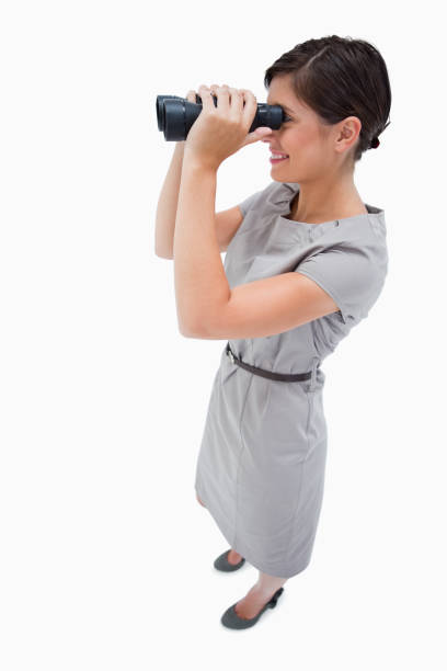 istock Side view of woman using spyglasses 847484670