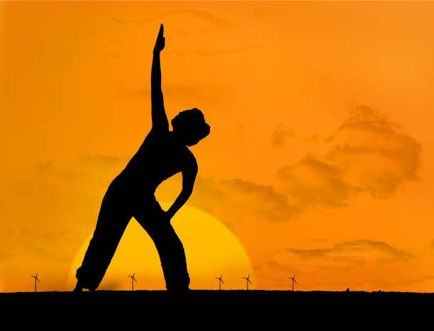 istock Calm silhouette of woman practicing yoga 847487472