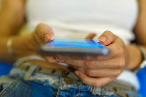 istock Young woman texting on smartphone at home bedroom at night 847488758