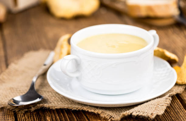 istock Chanterelle Soup on wooden background; selective focus 847488938