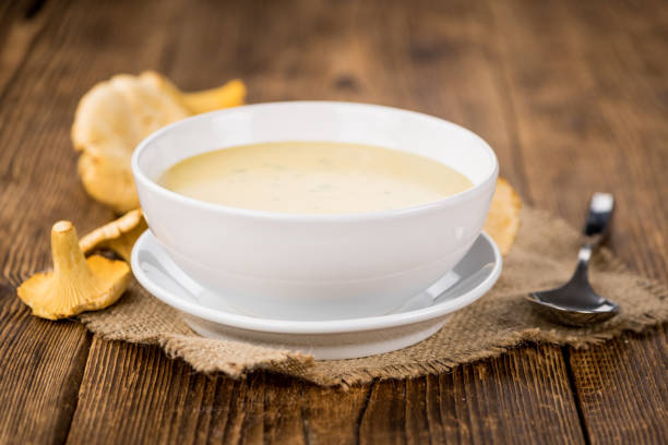 istock Chanterelle Soup on wooden background; selective focus 847489070