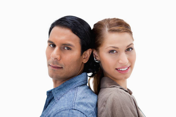 istock Side view of young couple standing back-to-back 847496158