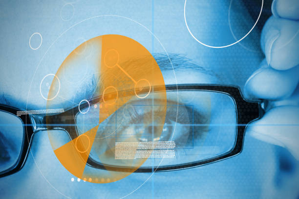 istock Woman wearing glasses with orange identification technology 847496216
