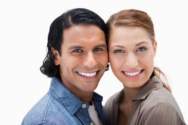 istock Smiling couple standing close together 847496230