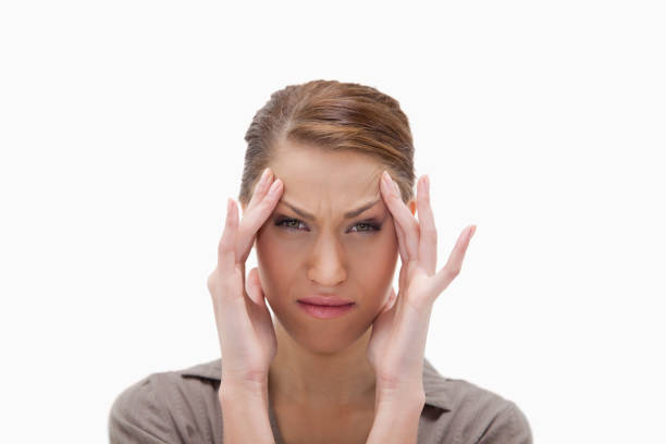 istock Sick woman rubbing her temples 847496748