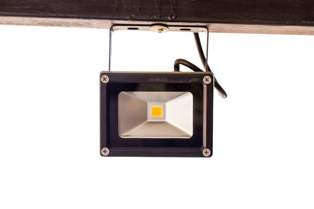 istock spotlight hanging at steel bar. isolated on white background. 847502850