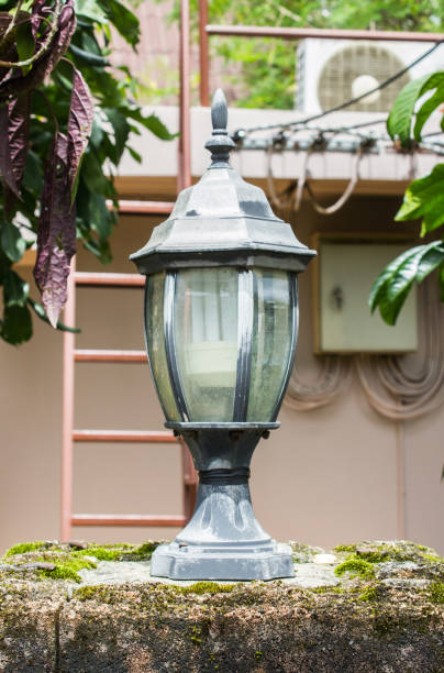 istock Old vintage light on concrete fence. 847502988