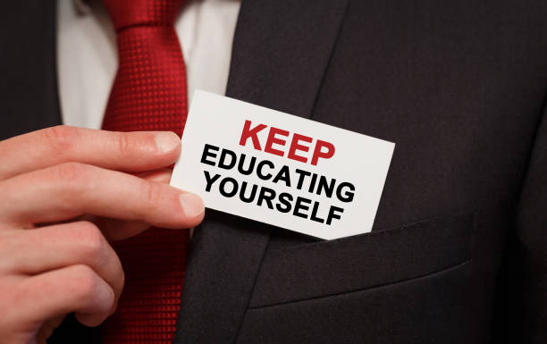 istock Businessman putting a card with text Keep Educating Yourself in the pocket 847506322