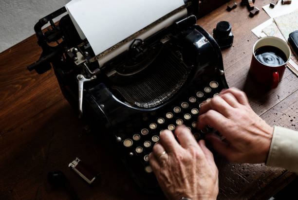 istock Closeup of hands typing retro vintage typewriter 847506526