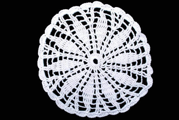 white round lace tablecloth isolated on black background, close up - pillow cushion embroidery homewares imagens e fotografias de stock