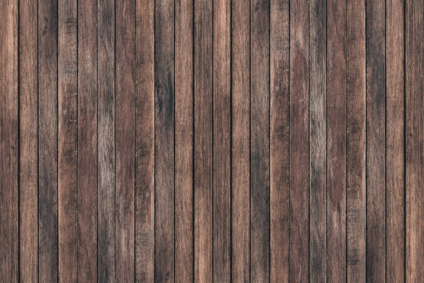 Vintage surface wood table and rustic grain texture background. Close up of dark rustic wall made of old wood table planks texture. Rustic brown wood table texture background template for your design.