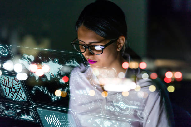 woman engineer looking at various information in screen of futuristic interface. - agilidade imagens e fotografias de stock