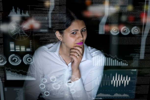 istock woman engineer looking at various information in screen of futuristic interface. 847519146