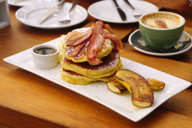 istock Grilled bacon on the layer of pancake serving with grilled banana 847523428
