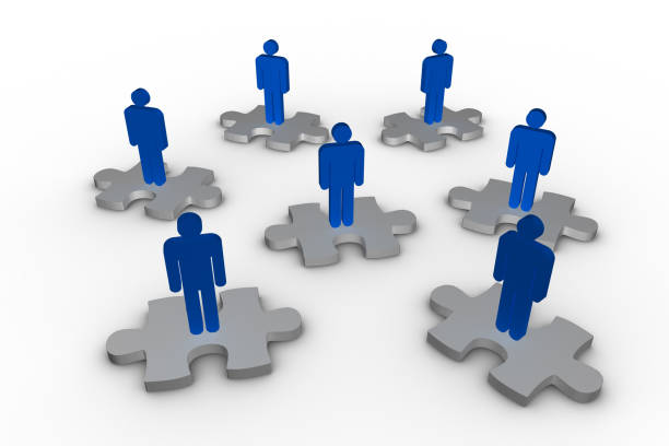 istock Strewn blue human representation standing on jigsaw pieces 847526534