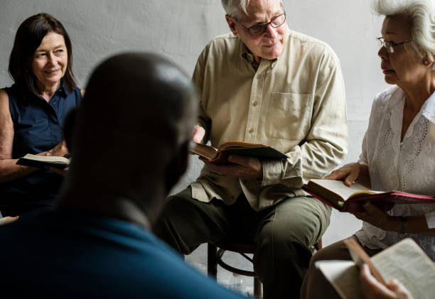 istock Group christianity people reading bible together 847527480
