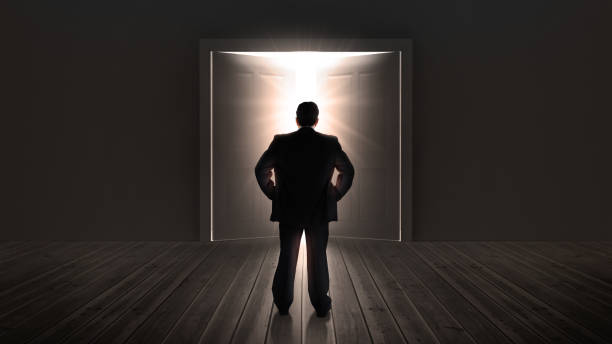 istock Businessman watching doors opening to a bright light 847534746