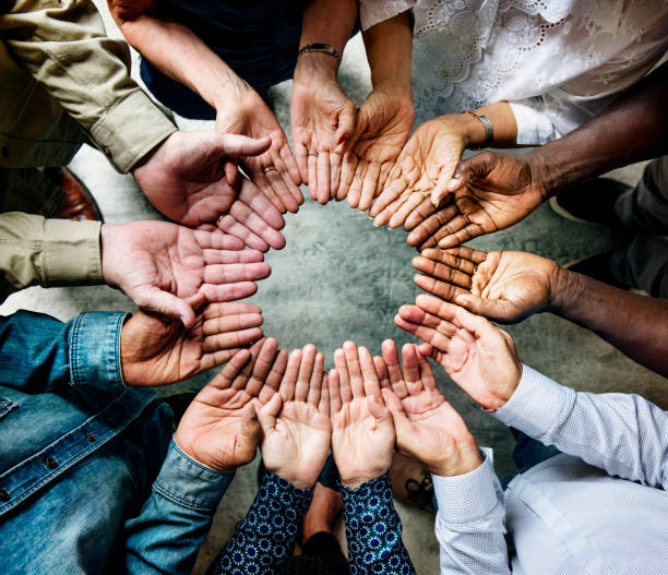 istock Group of diverse hands palms circle support together teamwork aerial view 847541546