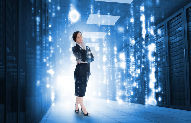 istock Businesswoman standing and looking thoughtful in data center 847546114