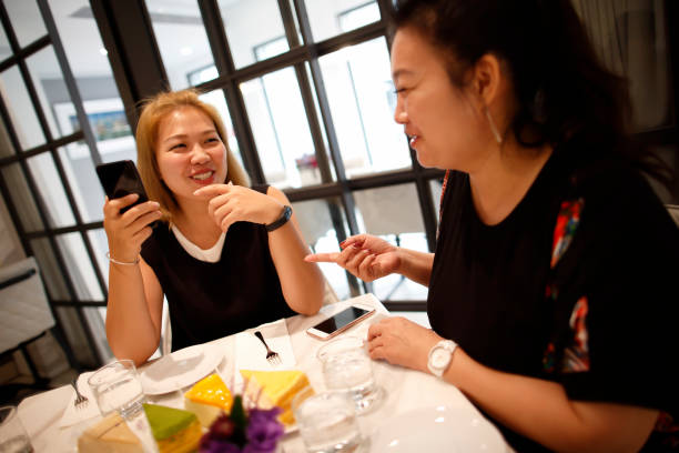 istock Women enjoy afternoon tea 847549832