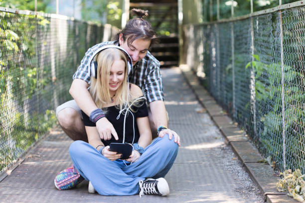 istock Young couple having fun with social media on digital tablet 847550042