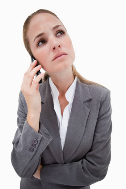 istock Sad bank employee on her cellphone 847560782