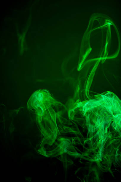 istock Green smoke motion on black background. 847561906